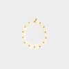 Gouden armband met witte hartjes