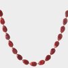 Gouden ketting met grote rode resin kralen