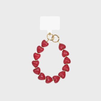 Rood telefoonkoord met acryl hartjes en gouden ringen