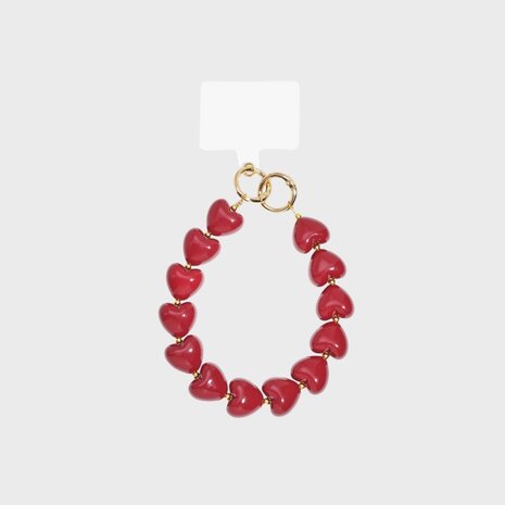 Rood telefoonkoord met acryl hartjes en gouden ringen