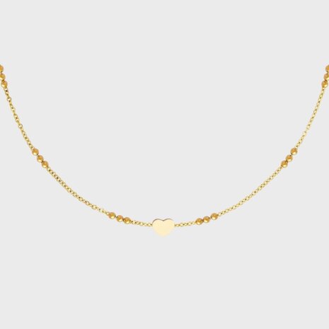 Gouden stainless steel ketting met hart en drie kraaltjes verstelbaar