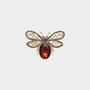 Broche bij bruin